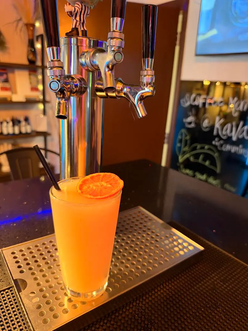 An orange kavatail with a dried orange wheel at the tap